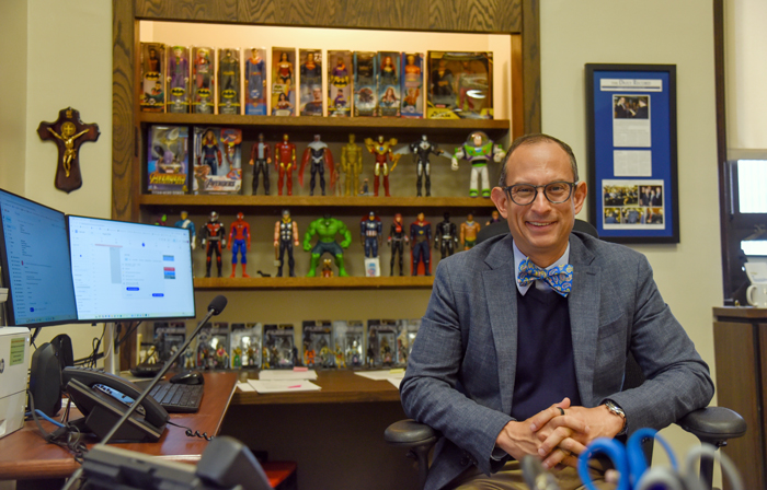 The Hon. Horacio Wheelock in the office he shares with dozens of action figures.