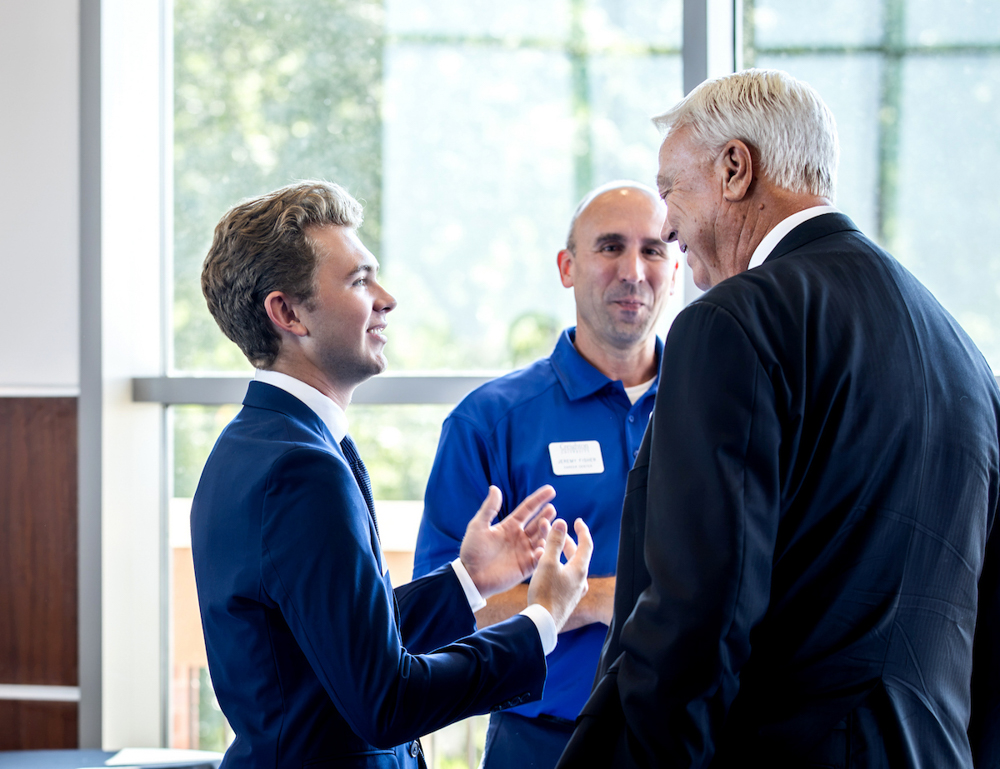 Garrett Fleenor, left, and Jeremy Fisher, center, speak with Jim Greisch.