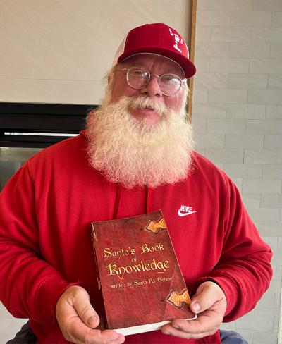Santa with his Santa's Book of Knowledge