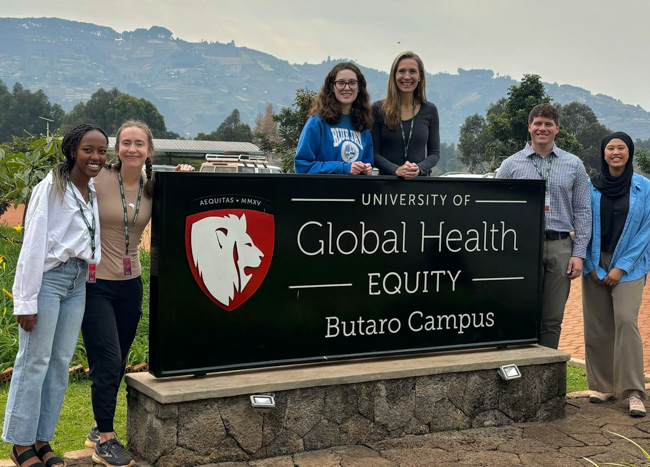 Arrupe director Jason Beste and Isra Eldosougi, right, with fellow Arrupe Scholars and faculty leaders in Butaro, Rwanda.