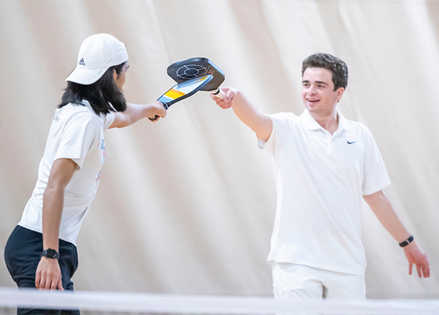 Pickleball teammates celebrating