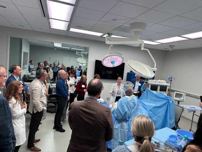 The Council of Regents observe a health sciences simulation in the CL and Rachel Werner Center during a recent campus immersion.