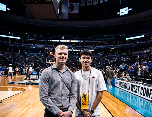Max Fritsch, left, and Xavier Rincon on the floor of Denver's Ball Arena for March Madness.