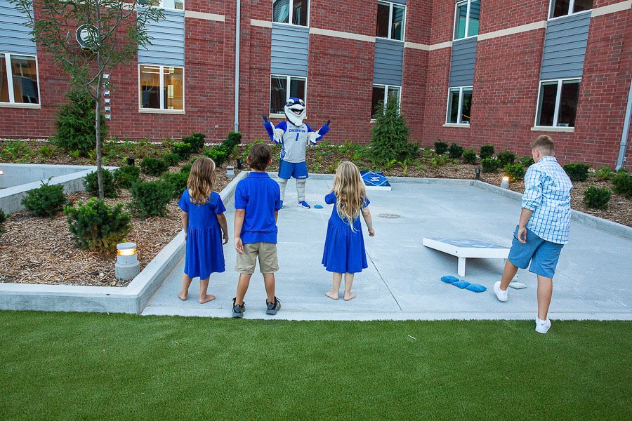 Billy entertains a group of children in the Simpson Family Courtyard.