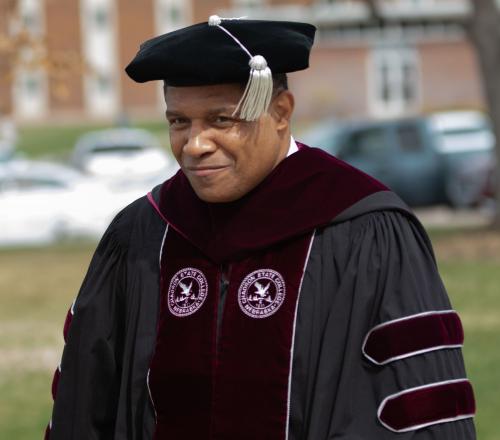 Ron Patterson walks outside and smiles on his inauguration day