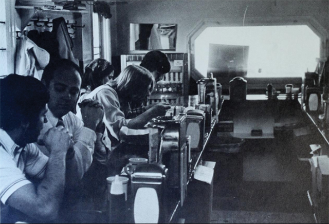 Interior shot of Beal's Grill. Guests at the u-shaped bar.