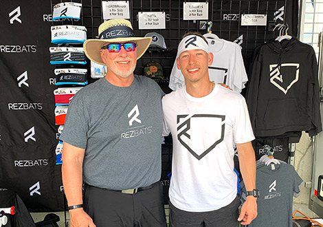 Dave and Ben Reznicek at the RezBats tent during the 2021 College World Series.
