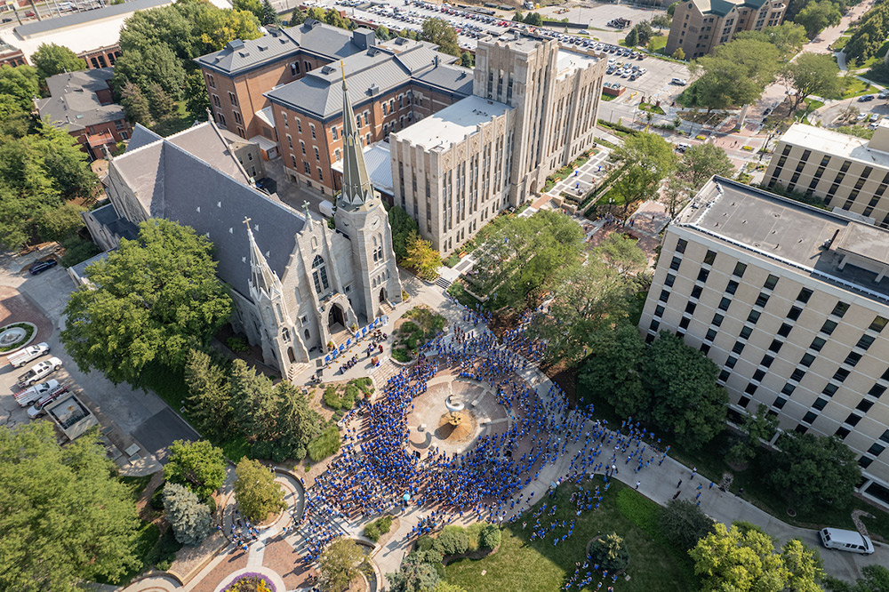 Students walk along the Mall for Creighton Pathway.