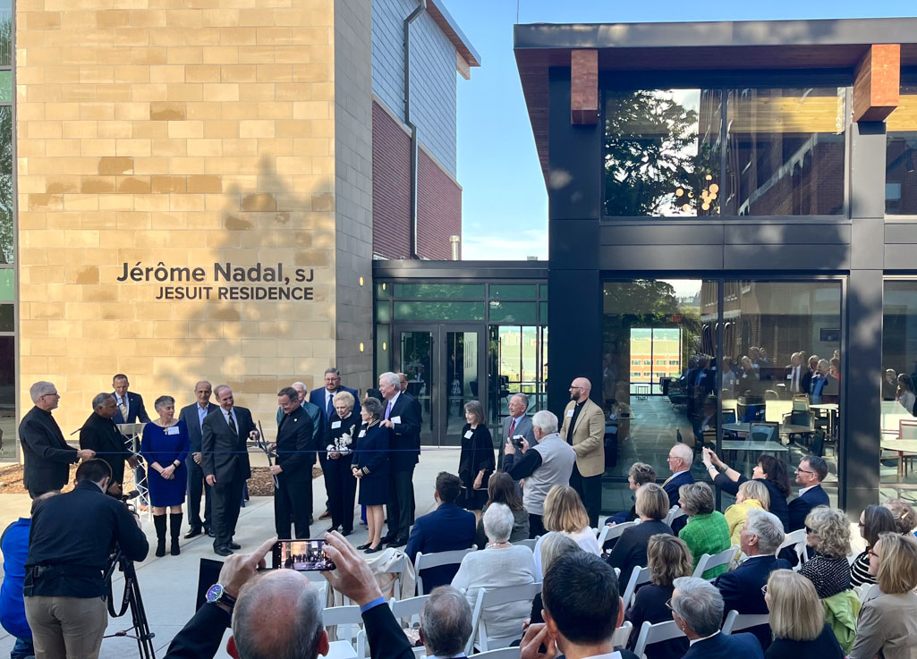 Donors and guests join Creighton leaders for a ribbon cutting ceremony