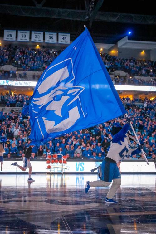 Creighton's mascot carries a flag on the court