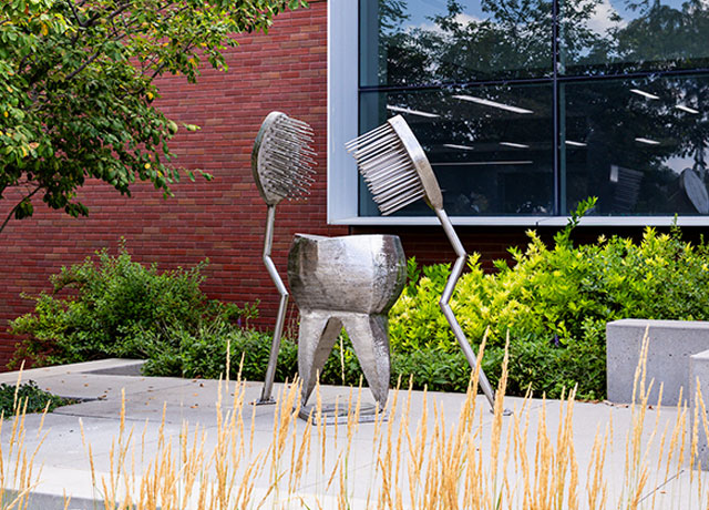 Tooth and toothbrush statue at Creighton Dental School