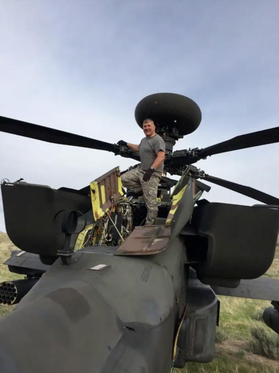 Matthew Badell on top of a helicopter