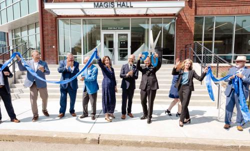 Campus leaders celebrate a ribbon cutting
