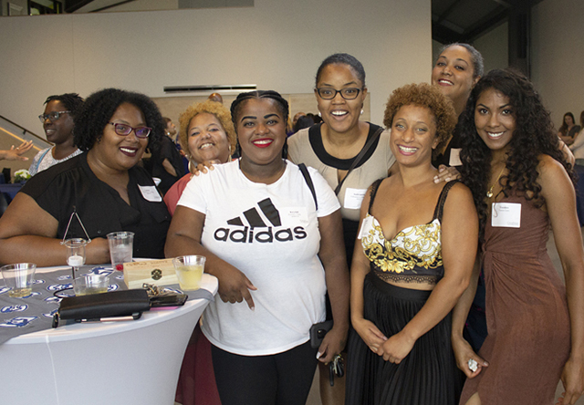 A group of alumni pose for a photo at the Black Alumni Gathering.