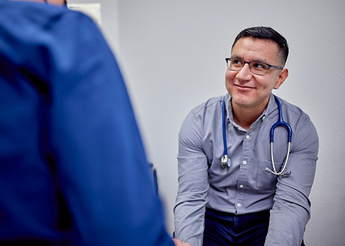 Image of a medical student treating a patient. 