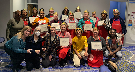 The fourth graduating class of the Cura Project, pictured with instructors.