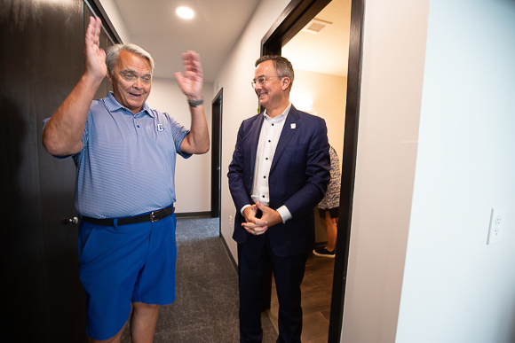 Jim Simpson and Fr. Hendrickson on a tour of Graves Hall.