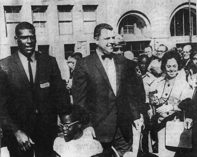 Gibson, his daughter Annette and Omaha Mayor James Dworak pass by the welcome-home crowd at city hall on Bob Gibson Day in 1964.