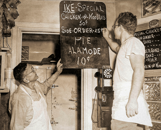 Walt, left, and a Beal's employee write in the day's specials.