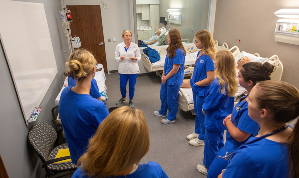 Nursing students in a simulation.