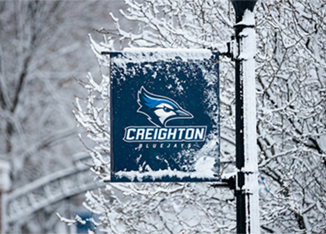 Creighton campus sign in snow