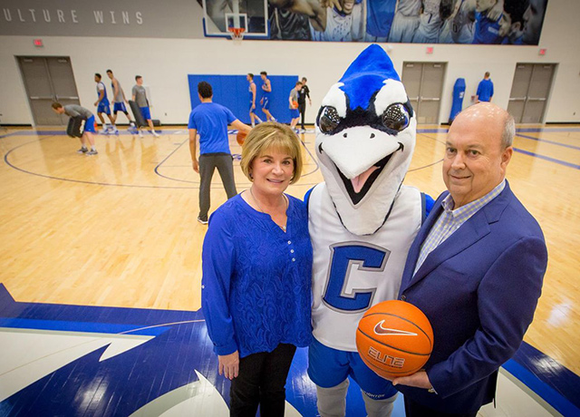 Janie and Harry Hoch, Jr. pose with Billy Bluejay.