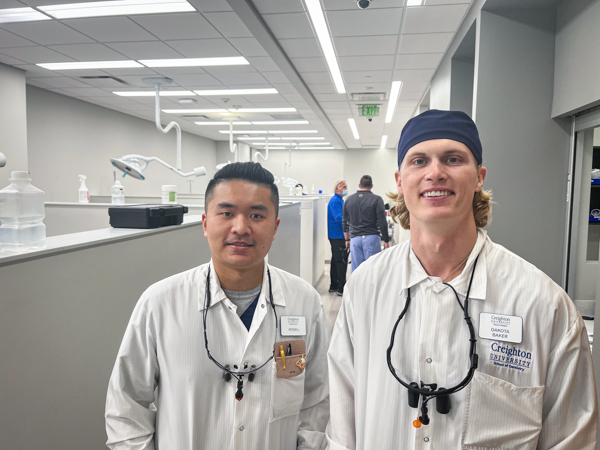 D4 students Peter Liang, left, and Dakota Baker in the After-hours Clinic.