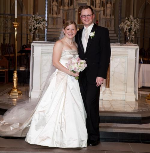 Kaity and Jarrod Reece smiling together at their wedding.