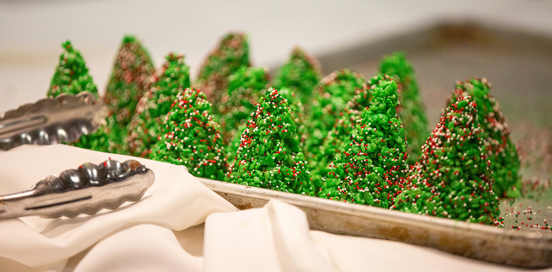 Cookies shaped like Christmas trees at the Christmas at Creighton event.