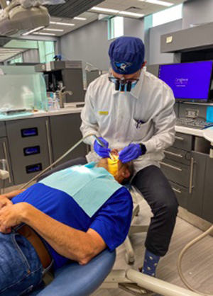 George Noesen performs operative dentistry on his father. George Noesen performs operative dentistry on his father.