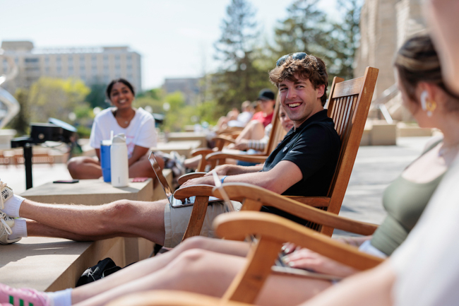 Images of students in rocking chairs at Creighton Hall. 