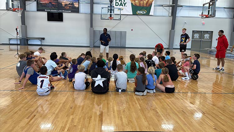 Donovan Mann coaching youth in gym