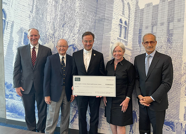 Piper Trustee Steve Zabilski, Piper Trustee Paul Critchfield, Fr. Daniel S. Hendrickson, Piper CEO and President Mary Jane Rynd and Creighton Board Chair Nizar Ghoussaini, BS’75, MS’76.