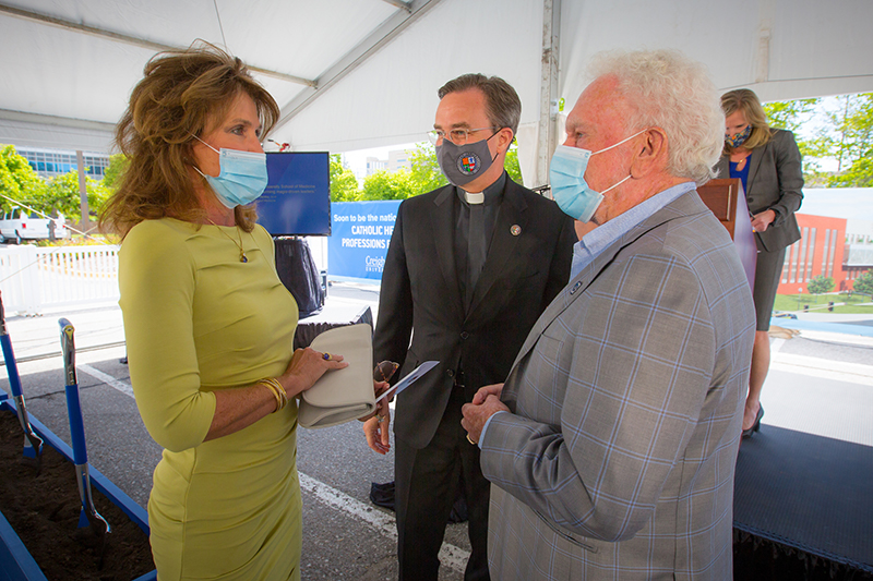 From left: Rachel Werner, Father Hendrickson and CL Werner at the ceremonial groundbreaking for the Werner Center.