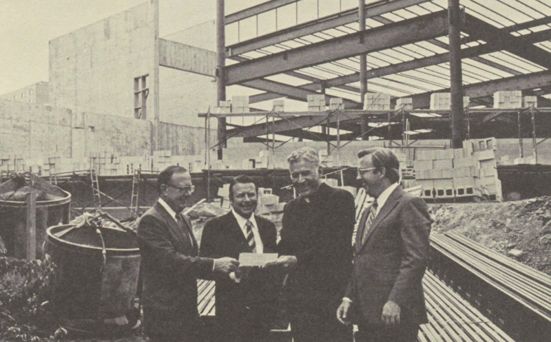 William and Robert Ahmanson, left, with then-President Reinert and Dean Frankino, as the Ahmanson Law Center is being constructed behind them.