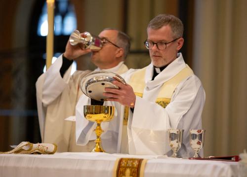 A priest presides over Mass