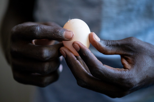 Abraham holds an egg. 