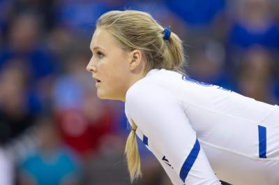 Taryn Kloth stands with her hands on her knees during an indoor volleyball match