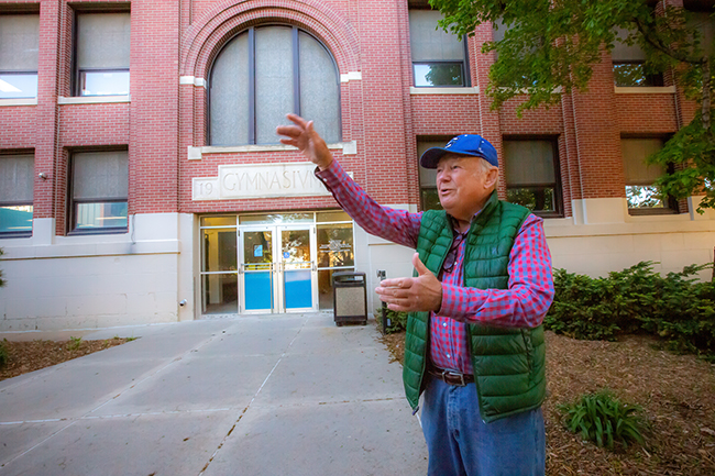 Doug Ryan in front of the Old Gym. Photo by Dave Weaver.