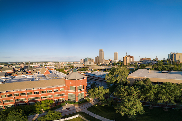 Harper Center against Omaha skyline.