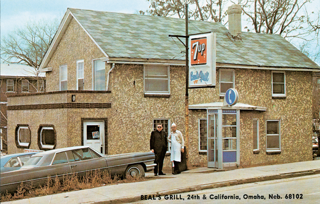 A Beal's postcard with a picture of Fr. Cahill and Howard in front of Beal's in the mid-1980s.