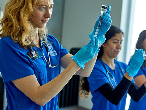 Nurses preparing shots