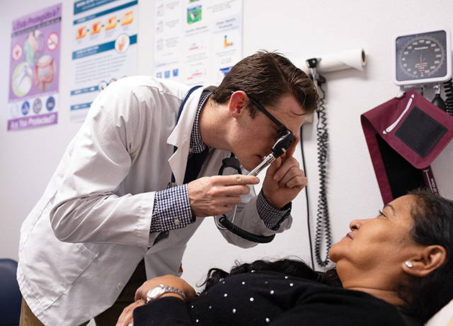 Physician examines a patient at St. Vincent