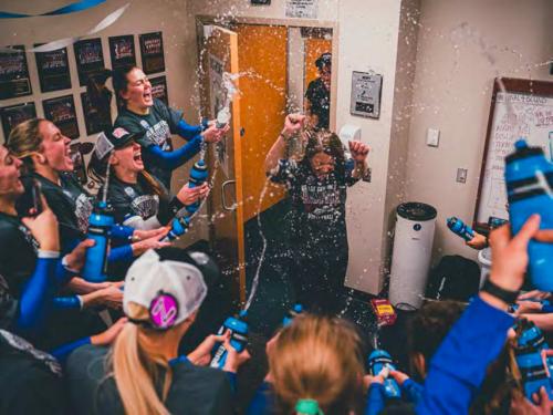 Creighton's volleyball team celebrates in the locker room