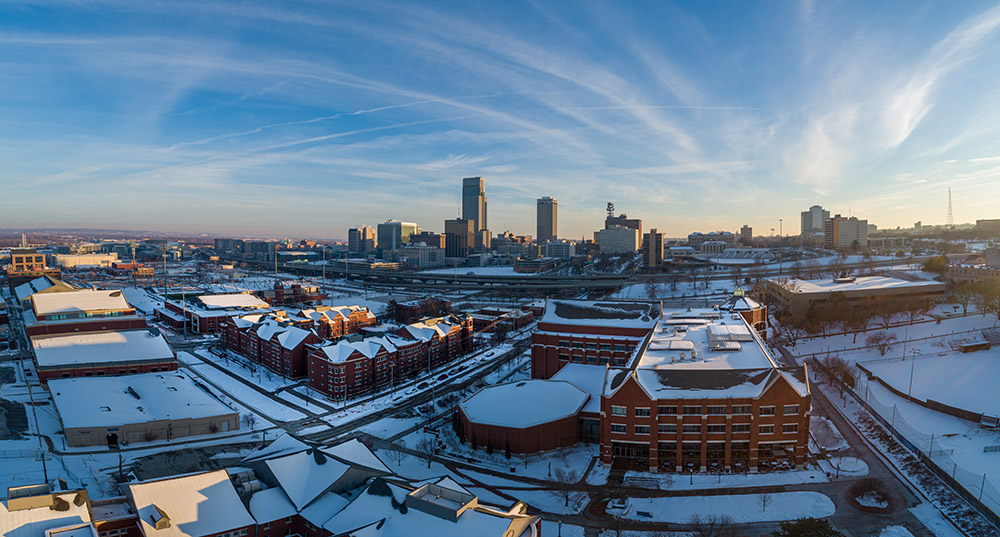 Drone shot of the Harper Center with downtown Omaha in the background.