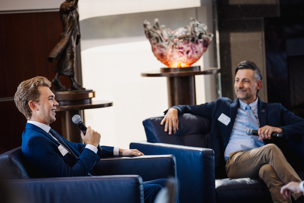 Heider College of Business student and entrepreneur Garrett Fleenor, left, during a Q&A with Nathan Preheim at the dedication event.