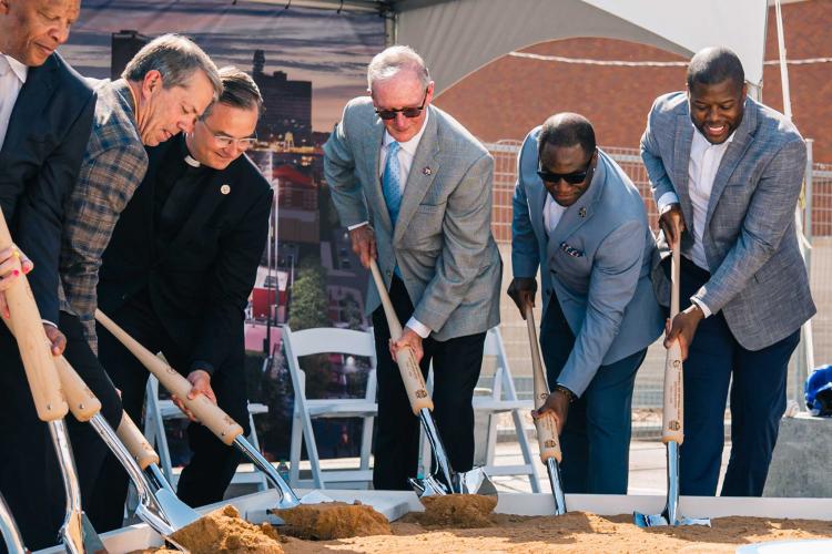 Baseball Softball Groundbreaking Diesing and more A group of people put shovels into dirt