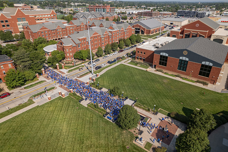 Students walk along the Mall for Creighton Pathway.