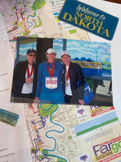 A photo of three sisters on top of a map