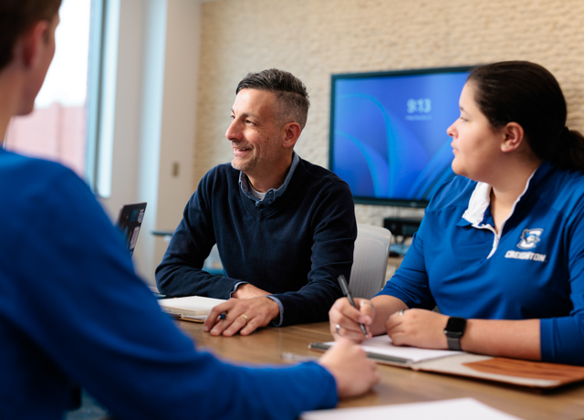 HCOB faculty and students meet.